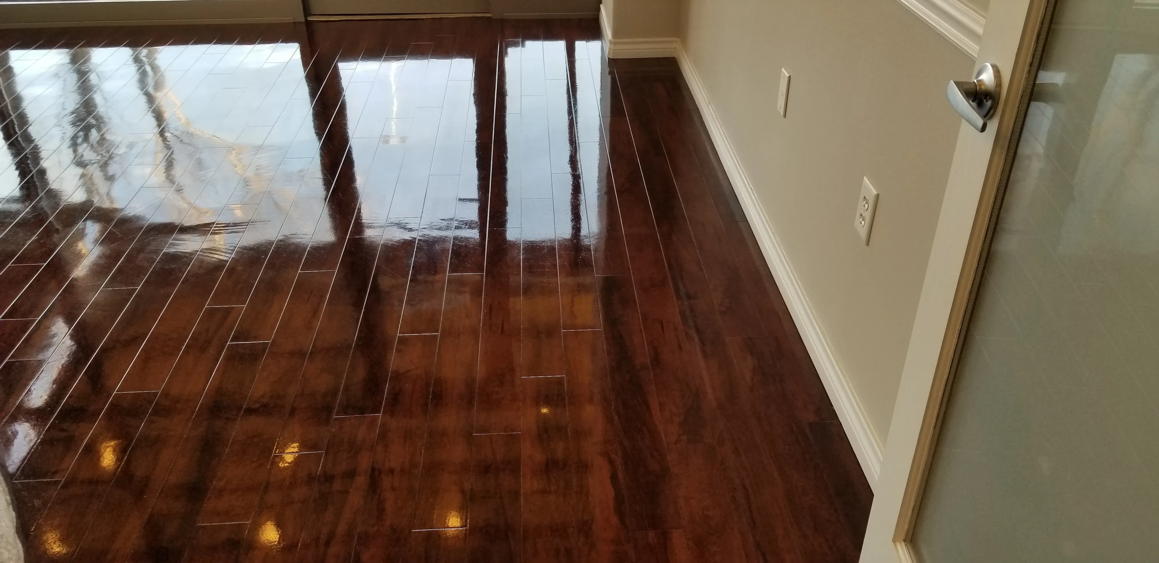 Hardwood flooring cleaned and refinished to a deep, warm sheen