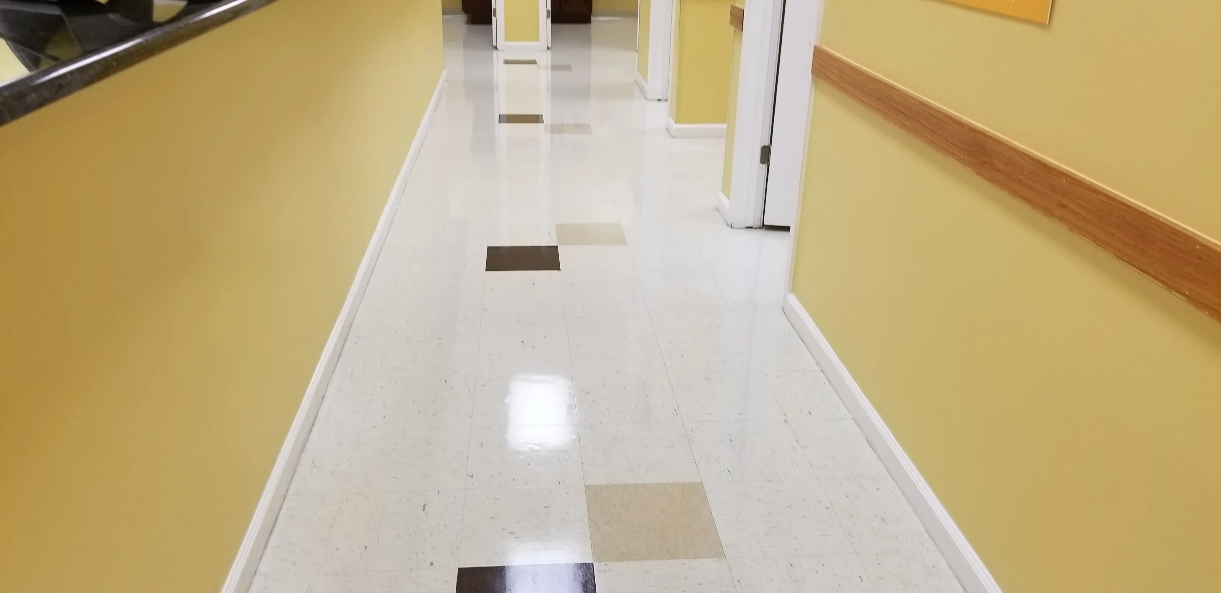 VCT floor restoration in a doctor's office hallway