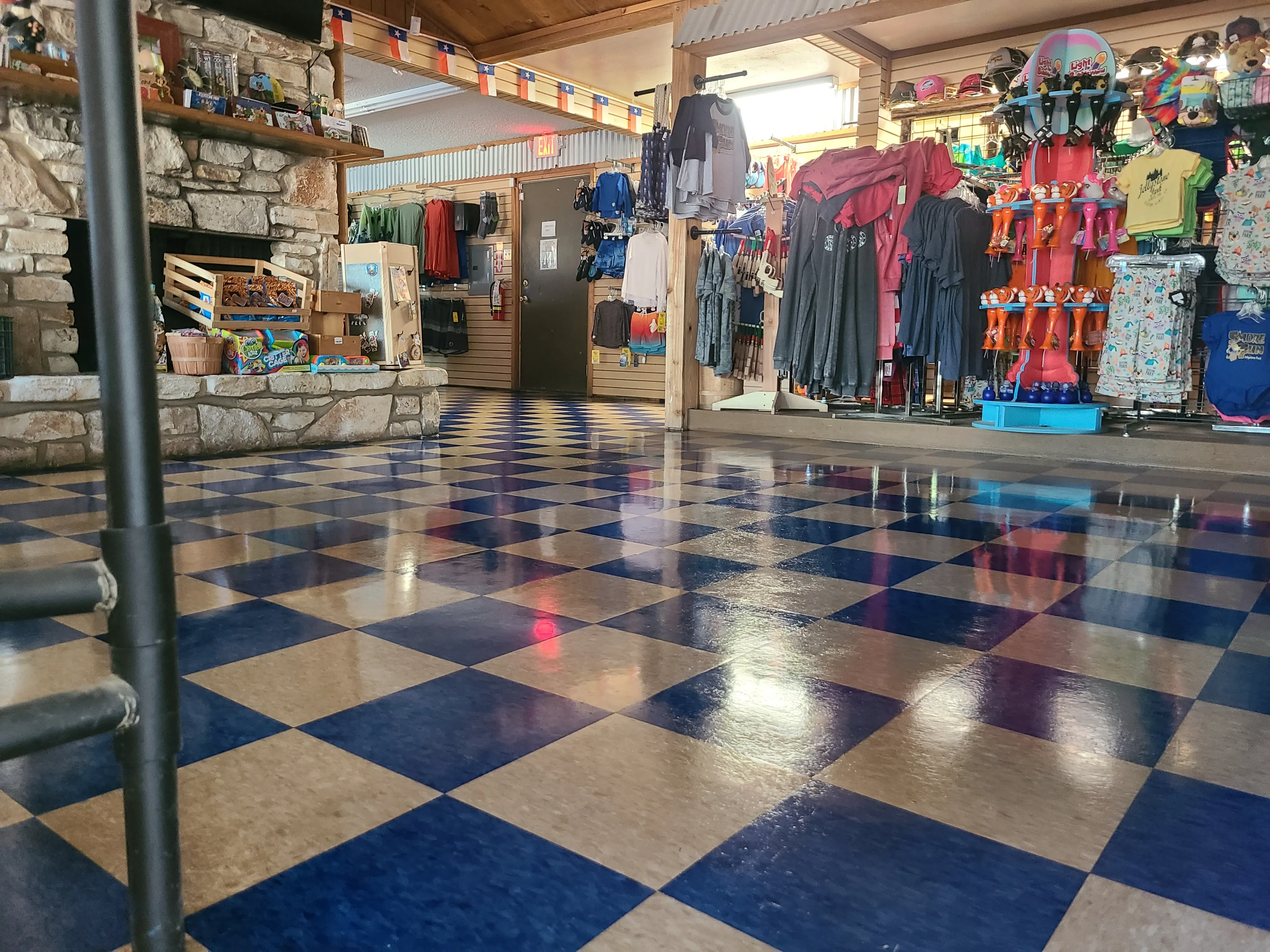 VCT flooring inside a retail storefront after a strip-and-wax service