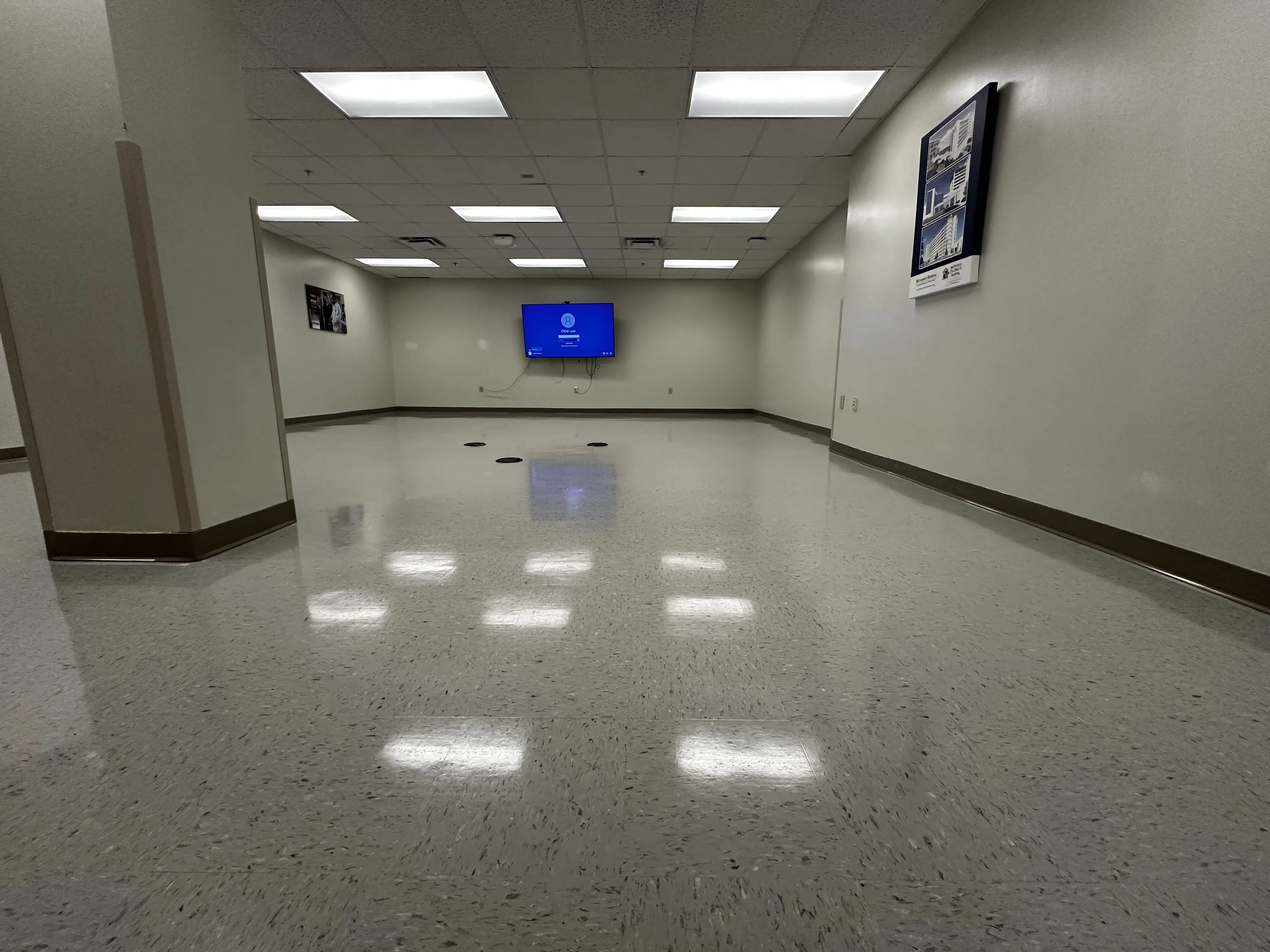 Large hospital waiting room with a uniform high-gloss VCT wax coat