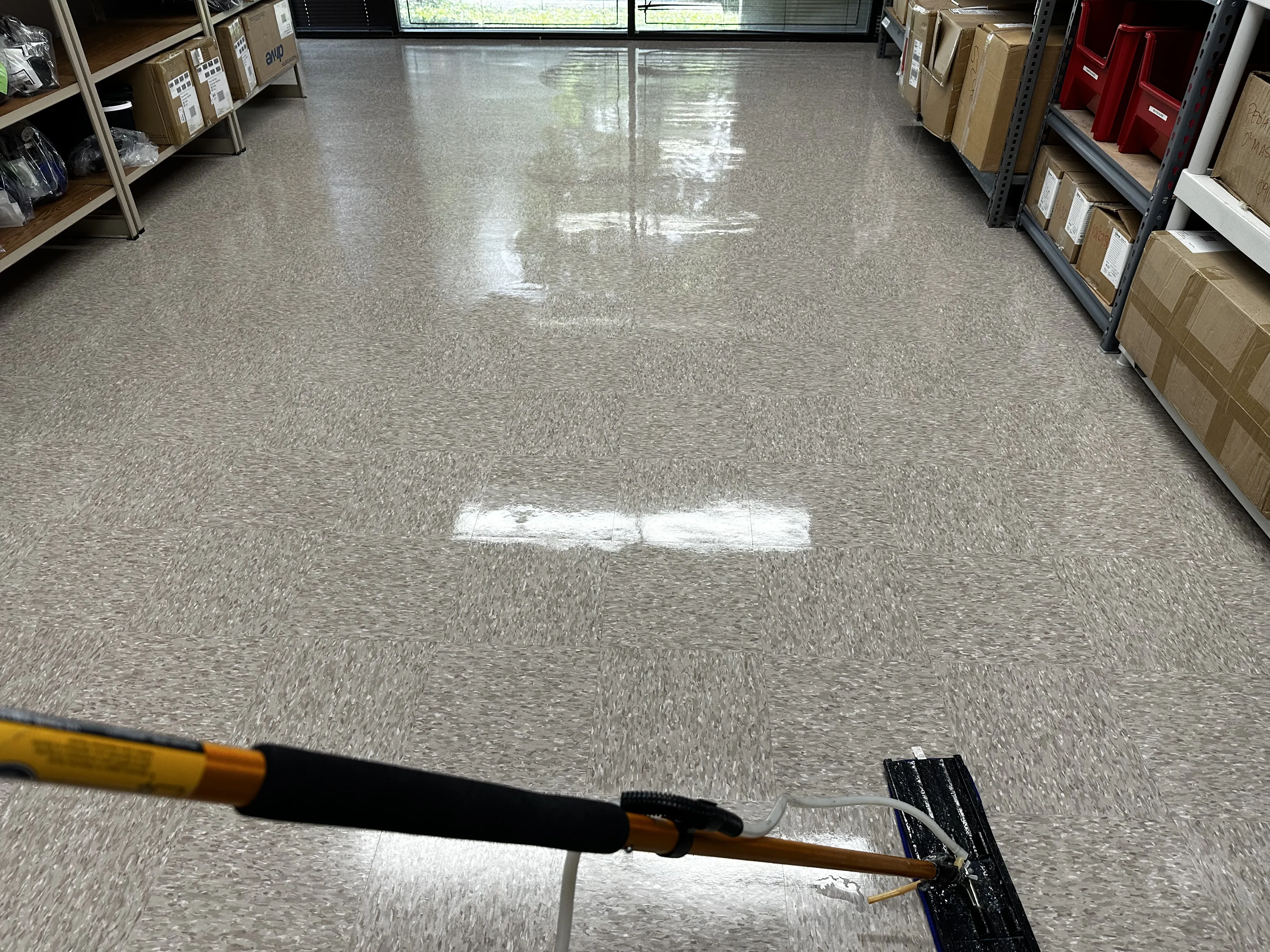 Office new VCT flooring after sealing and applying the first coat of wax